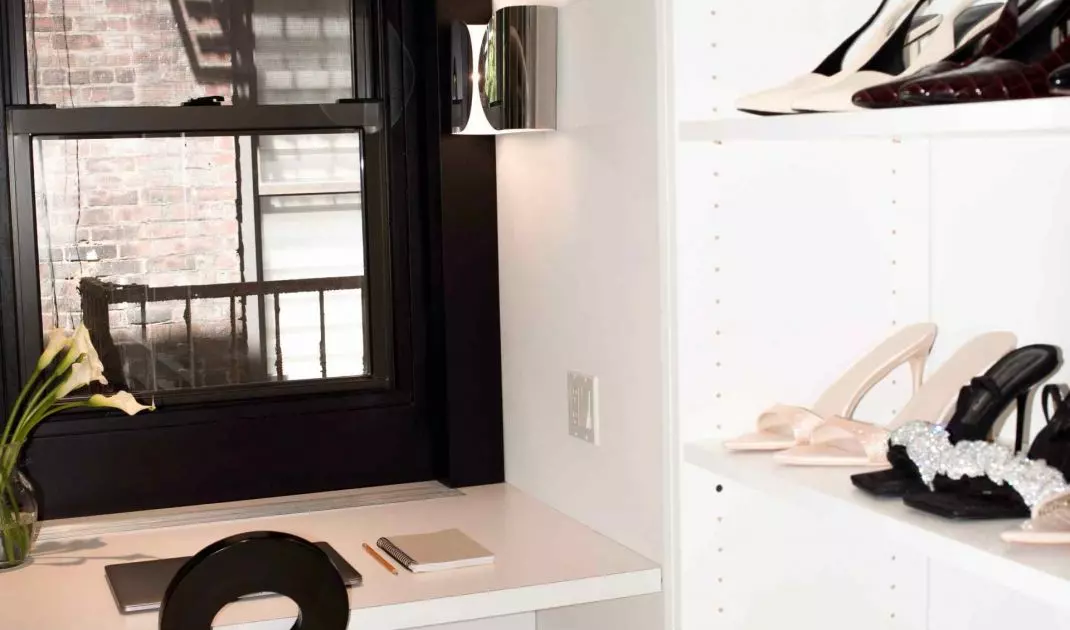 Behind the glass door is a walk-in closet