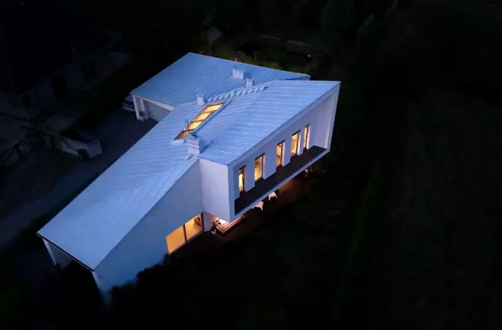 Irregular body of the house stands out in the Silesian landscape