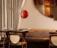 Designers juxtapose raw walls with soft curtains