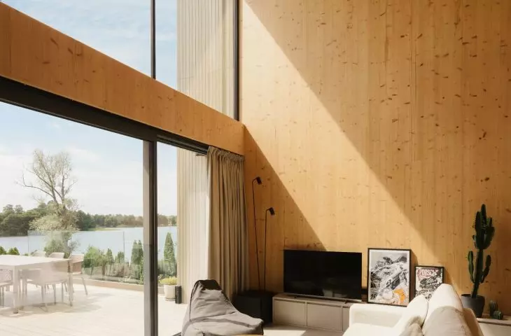 Lakeside home; large glass windows frame lake views