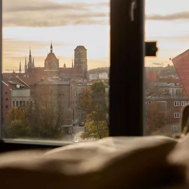 The 88-square-meter apartment, located in the center of Gdansk, was designed to make the most of its location.