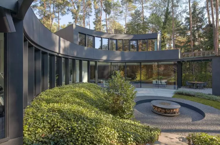 house structure like arms embrace the clearing