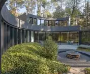 house structure like arms embrace the clearing