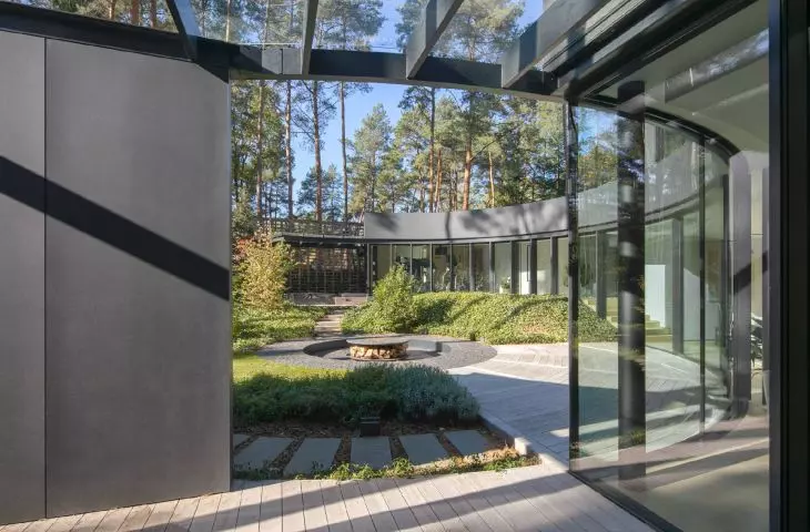 the curved line of the house in the lower part is almost entirely glazed