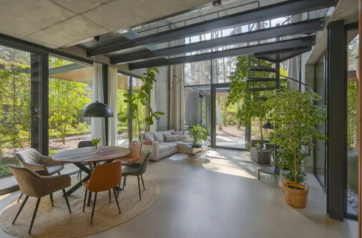 view from the dining room to the lounge area and the spiral staircase leading to the mezzanine floor
