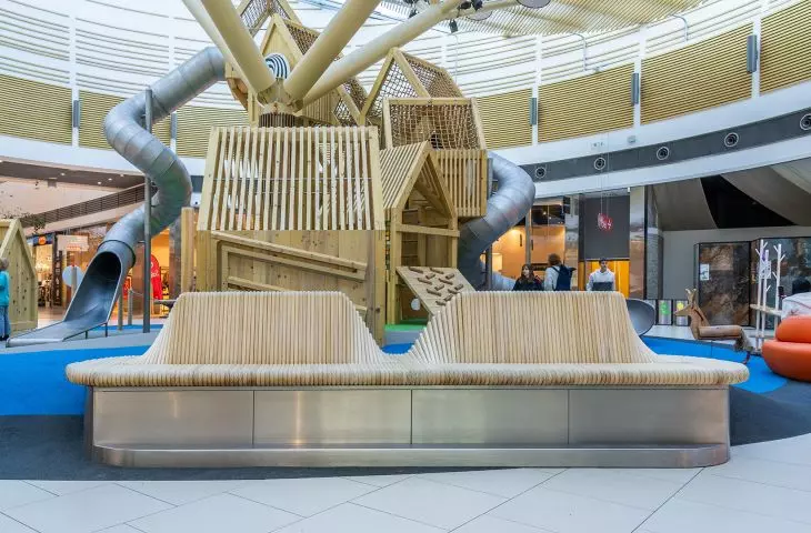 Moveart bench and Richter Spielgeräte playground forming a cohesive micro-architecture redefining leisure and play space