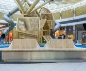 Moveart bench and Richter Spielgeräte playground forming a cohesive micro-architecture redefining leisure and play space