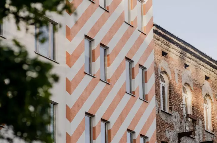 diagonal orange stripes on the facade