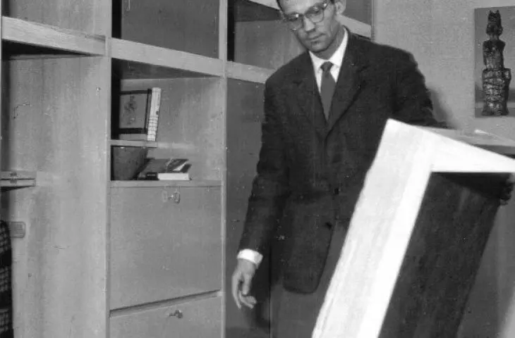 Czeslaw Kowalski against a background of a wall unit, Kowalski Furniture, 1962.
