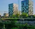 in the background of the completed buildings, you can see the next stages of the investment being built
