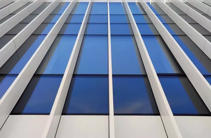 Procural aluminum joinery, Stacbond ventilated facade, and perforated aluminum cassettes