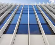 Procural aluminum joinery, Stacbond ventilated facade, and perforated aluminum cassettes