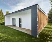 thanks to large glazing, residents can easily move from the living room to the spacious garden