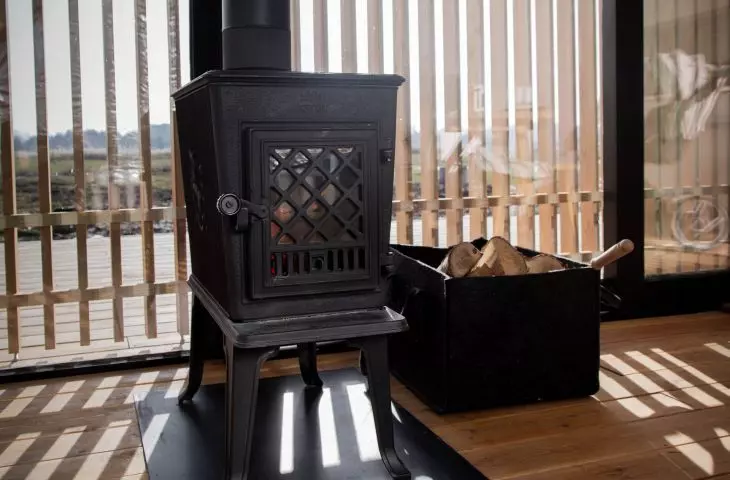 A small fireplace provides warmth in the house 