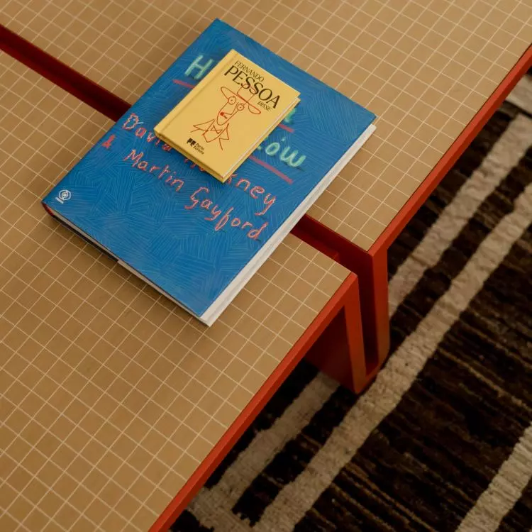 The tiled coffee tables in the living room combine a geometric pattern with warm colors