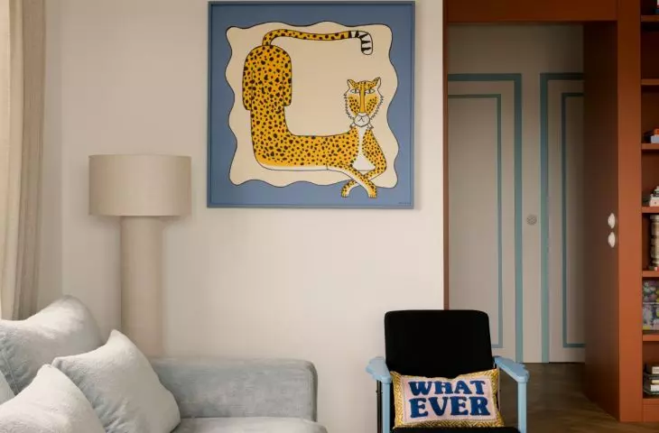 The bedroom exudes a sense of calm, but a few bold accents serve as a reminder of the character of the entire apartment