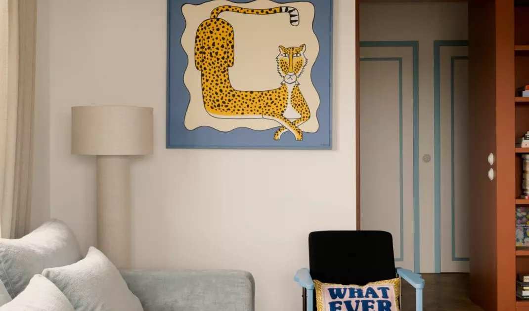 The bedroom exudes a sense of calm, but a few bold accents serve as a reminder of the character of the entire apartment