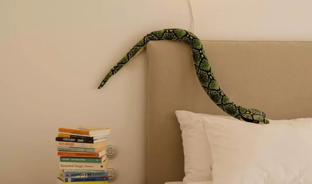 The bedroom exudes a sense of calm, but a few bold accents serve as a reminder of the character of the entire apartment