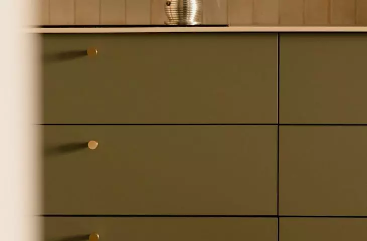 The countertop coffee maker fits right in with the character of the apartment, where functionality meets a love of design.