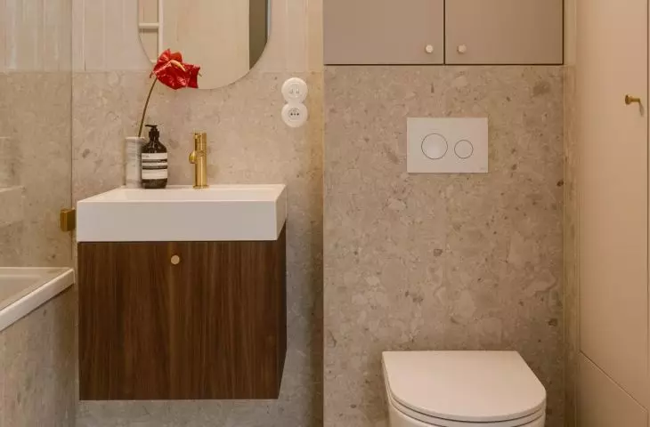Terrazzo-effect tiles subtly evoke a retro aesthetic