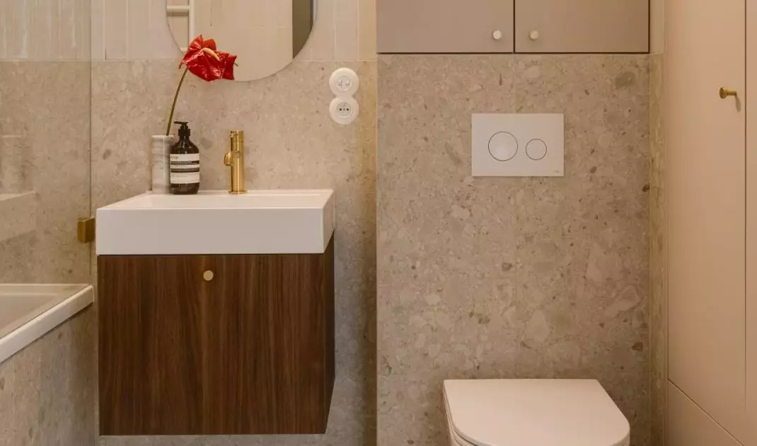 Terrazzo-effect tiles subtly evoke a retro aesthetic