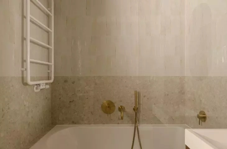 The bright bathroom has a calm design, but it's not without character