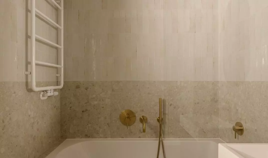 The bright bathroom has a calm design, but it's not without character