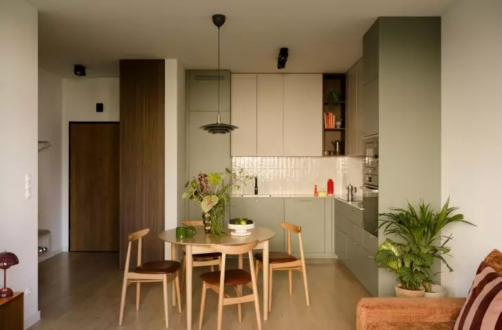 The open-concept living area combines the kitchen, dining room, and living room into a single airy, cohesive space