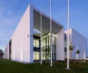 the office building is divided into three functional segments separated by atria
