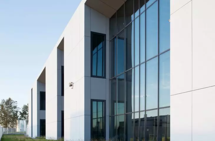 large glazings illuminate the interiors of the building