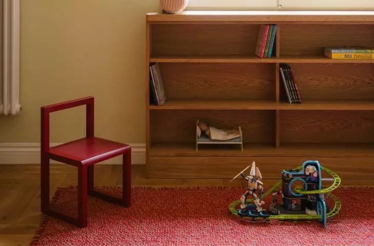 Red appears here not only as a bold accent, but also as a way to warm up and liven up the room