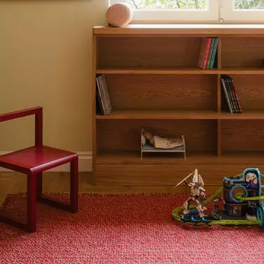 Red appears here not only as a bold accent, but also as a way to warm up and liven up the room