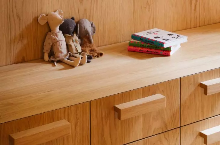 Wooden built-ins help organize the space, while small items give it a more personal touch