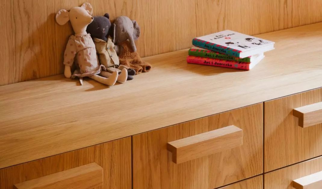 Wooden built-ins help organize the space, while small items give it a more personal touch