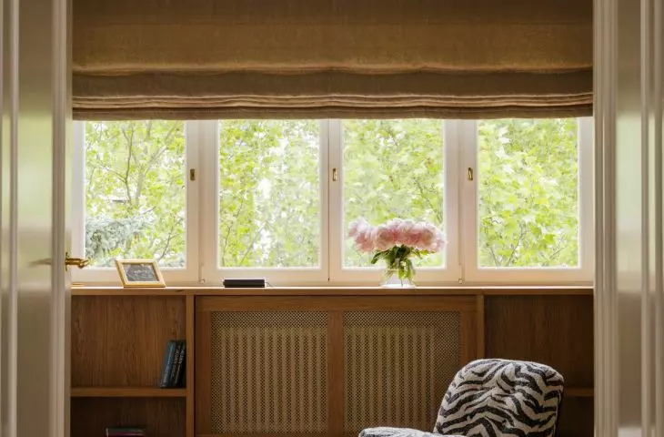 Wood, soft fabrics, and a patterned armchair create a more serene atmosphere here