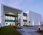 The center is formed by a two-story office building and an exhibition and laboratory hall