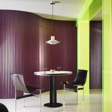 In the dining room, color, light, and neon acrylic set the stage for everyday gatherings
