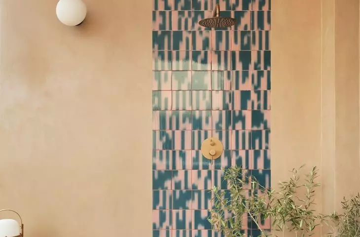 The terrace features patterned tiles, plants, and warm tones that soften the intensity of the interior
