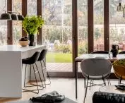 Living area overlooks garden full of greenery