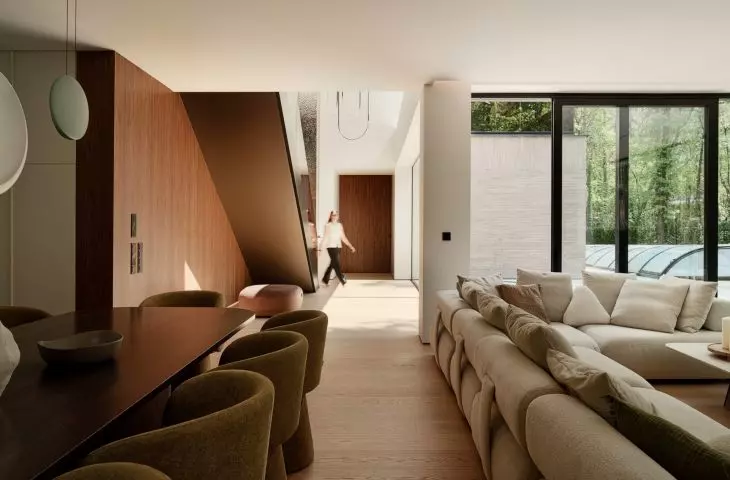 The rooms flow seamlessly into one another, and the large windows draw the eye toward the garden