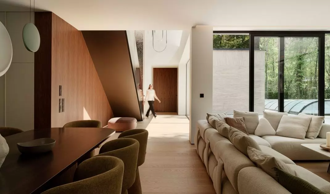 The rooms flow seamlessly into one another, and the large windows draw the eye toward the garden