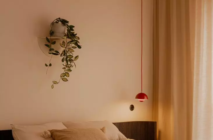 The bedroom features a light, soothing color palette
