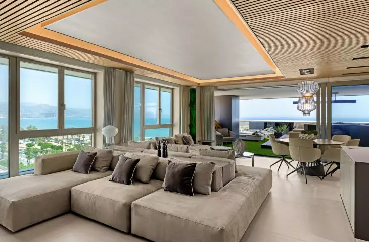 A two-section sofa helps organize the living room layout and allows you to use the space in several ways 