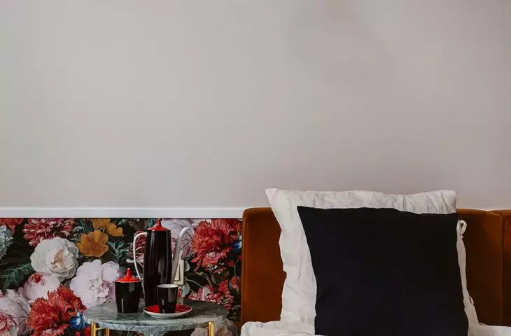 Patterned wallpaper reigns supreme on part of the wall