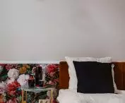Patterned wallpaper reigns supreme on part of the wall