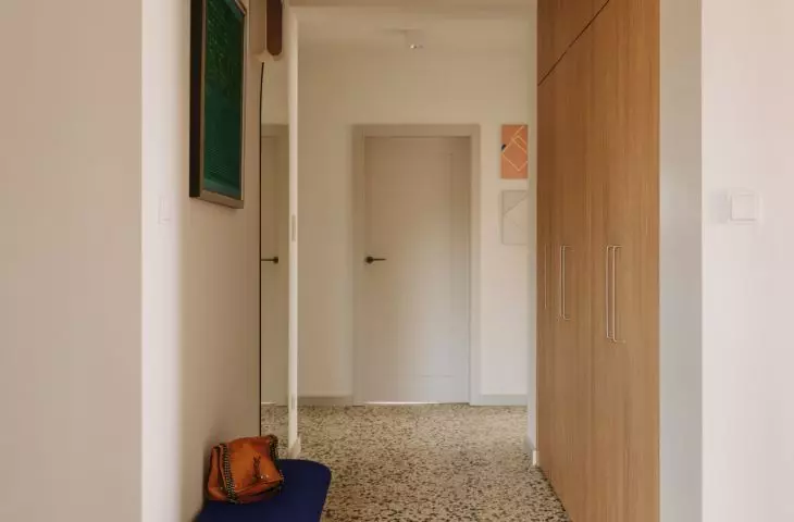 This Wrocław apartment, designed by Buduar, combines art, vintage furniture, and warm, bold colors