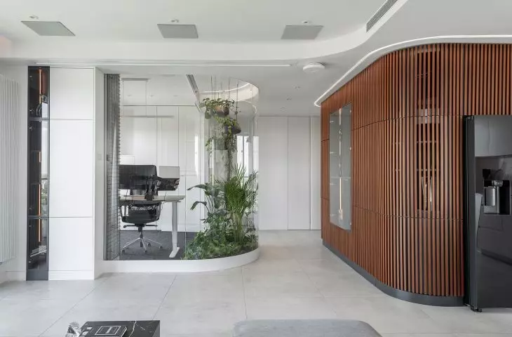 An apartment with a palm house in Warsaw, designed by AMJ Studio