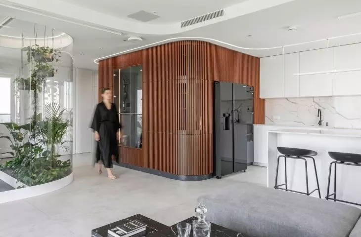 An apartment with a palm house in Warsaw, designed by AMJ Studio