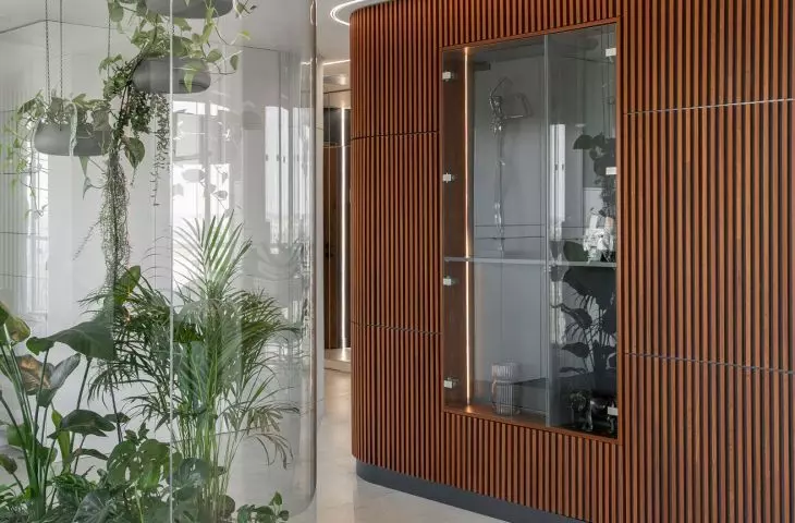 An apartment with a palm house in Warsaw, designed by AMJ Studio