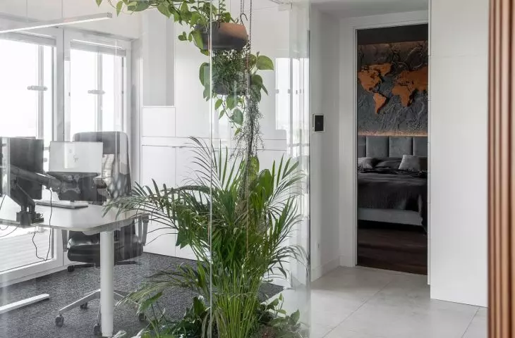 An apartment with a palm house in Warsaw, designed by AMJ Studio